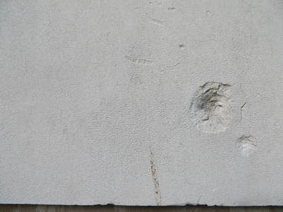 Portland Stone at close range, scarred by wartime shrapnel
